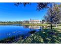Scenic view of building reflected beautifully in calm pond water at 9008 White Sage Loop # 3605, Lakewood Ranch, FL 34202