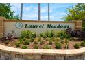 Attractive stone sign and landscaping at the entrance to Laurel Meadows at 9101 Yarberry St, Sarasota, FL 34240