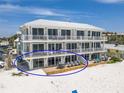 Gorgeous condo featuring a spacious deck with seating area, perfect for enjoying beachfront living at 101 66Th St # 1, Holmes Beach, FL 34217