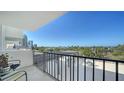 Relaxing balcony space with black iron railing and beautiful views of the water and marina at 101 S Gulfstream Ave # 5J, Sarasota, FL 34236