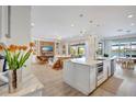 Modern kitchen with stainless steel appliances and a large island at 11913 Blue Hill Trl, Bradenton, FL 34211