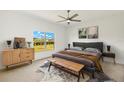 Comfortable bedroom with a large window overlooking the beautiful backyard at 16849 Castoro Dr, Port Charlotte, FL 33953