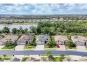 Expansive aerial shot showcases the neighborhood's layout with homes, ponds, and green spaces at 18045 Polo Trail St, Bradenton, FL 34211