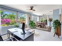Bright, open living space with desk overlooking a view to the outside; features modern decor at 3036 Rose St, Sarasota, FL 34239