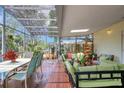 Comfortable screened-in patio furnished with seating and dining areas, great for enjoying the outdoors at 3036 Rose St, Sarasota, FL 34239