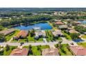 Gorgeous aerial view of an upscale community with a lake and lush landscaping at 356 Blackbird Ct, Bradenton, FL 34212
