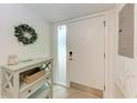 Bright foyer featuring a modern entry door with glass and a convenient console table at 3803 Sun Eagle Ln # 203, Bradenton, FL 34210