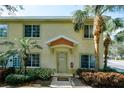 A charming two-story townhouse with lush landscaping and a welcoming entrance, creating a serene atmosphere at 3909 45Th W Ter # 102, Bradenton, FL 34210