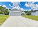 Well-maintained single-story home featuring a two-car garage, manicured lawn, and welcoming curb appeal at 4513 Abacos Pl, Bradenton, FL 34203