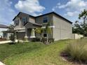 Attractive two-story home with neat landscaping and a well-maintained front yard at 5430 Amaryllis Garden St, Apollo Beach, FL 33572