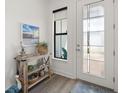 Bright foyer featuring stylish decor and a welcoming view into the home at 6248 Fish Eagle Ct, Nokomis, FL 34275