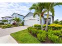 Well-maintained front yard and landscaping showcasing the home's curb appeal at 6295 Crested Eagle Ln, Nokomis, FL 34275