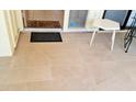 Tiled patio flooring with an entryway mat, a small table, and views of the outdoors at 6462 Wild Oak Bay Blvd # 245, Bradenton, FL 34210