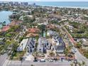 Expansive aerial shot showcases new homes in a tropical neighborhood with palm trees and waterfront scenery at 114 Fillmore Dr, Sarasota, FL 34236