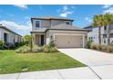 Charming two-story home with a well-manicured lawn and a two car garage, a welcoming Gathering home at 16119 Paynes Mill Dr, Bradenton, FL 34211