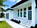 Welcoming front entrance with a decorative walkway and manicured landscaping at 217 Rotonda S Blvd, Rotonda West, FL 33947