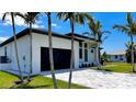 The garage is spacious and attached to the house with a nice driveway at 217 Rotonda S Blvd, Rotonda West, FL 33947