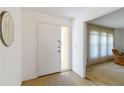 Bright entryway with a neutral color palette, a closet and access to living areas at 2271 Pine View Cir, Sarasota, FL 34231