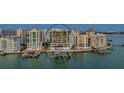 Waterfront luxury condo building with boat docks and swimming pool at 280 Golden Gate Pt # 600, Sarasota, FL 34236