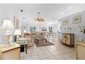 Spacious living room featuring tile floors, ceiling fan, and ample natural light at 4610 Runabout Way, Bradenton, FL 34203