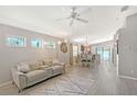 Living room with natural light, modern furniture, decorative lighting, and view of dining area at 4838 San Ortebello Dr, Bradenton, FL 34208
