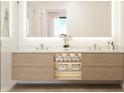 Contemporary bathroom featuring a double sink vanity with towel storage and a spacious glass-enclosed shower at 4950 Remington Dr # 114, Sarasota, FL 34234