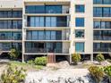 Waterfront condo building featuring multiple floors with individual balconies and gorgeous views at 6460 Mourning Dove Dr # 102, Bradenton, FL 34210