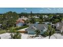 Beautiful home with a well-kept lawn and fence, with a peek of the lake in the background at 6924 34Th W Ave, Bradenton, FL 34209
