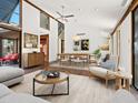 Bright and airy living room with modern furniture, high ceilings, and natural light at 7 Sandy Cove Rd, Sarasota, FL 34242