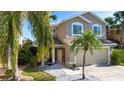 Inviting front yard with a charming bench seating area and a well-maintained walkway leading to the entrance at 7168 Chatum Light Run, Bradenton, FL 34212