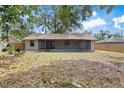 Expansive backyard featuring a screened lanai perfect for outdoor entertaining and relaxation at 920 36Th W St, Bradenton, FL 34205