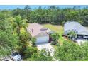 Lovely home with mature trees, well-maintained yard, and a welcoming front entrance at 11236 Beebalm Cir, Lakewood Ranch, FL 34202