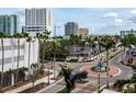 Charming city view featuring luxury apartments, palm trees, and public art at 1255 N Gulfstream Ave # 402, Sarasota, FL 34236