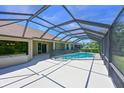 Spacious screened patio with a sparkling pool, offering ample space for outdoor enjoyment at 15518 29Th E St, Parrish, FL 34219