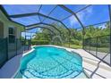 Inviting screened-in pool with a fountain feature and a -proof safety fence at 15518 29Th E St, Parrish, FL 34219