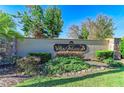 Community sign with lush landscaping at the entrance to Villa Milano at 2084 La Palma Ave, Port Charlotte, FL 33953