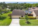 Well maintained single-story home with mature landscaping and a screened-in pool at 3698 Glen Oaks Manor Dr, Sarasota, FL 34232