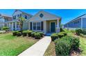 Inviting single-story home with a tidy lawn, trimmed bushes, and a quaint entryway, offering curb appeal at 4031 Cottage Hill Ave, Parrish, FL 34219