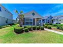 Attractive single-Gathering home showcasing lovely landscaping, a well-kept lawn, and a cozy entrance at 4031 Cottage Hill Ave, Parrish, FL 34219