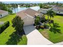 Charming home with a well-maintained lawn, mature trees, and long driveway leading to an attached two car garage at 4262 70Th Street E Cir, Palmetto, FL 34221