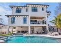 Luxury home showcasing an inviting pool, outdoor seating, and a stylish pool table area at 723 S Blvd Of The Presidents, Sarasota, FL 34236