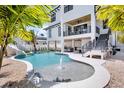 Resort-style pool with a water fountain, slide, and ample space for entertainment at 723 S Blvd Of The Presidents, Sarasota, FL 34236