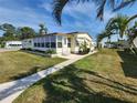 Lovely home featuring a screened lanai, manicured lawn, and a cozy, inviting entrance at 808 53Rd E Ave # 229, Bradenton, FL 34203