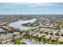 Aerial view of community showcasing lakefront properties and community amenities at 19138 Kirella St, Venice, FL 34293