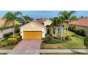 Charming single-Gathering home featuring a well-manicured lawn and a two-car garage at 19138 Kirella St, Venice, FL 34293