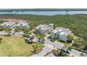 Scenic aerial view showcasing the beautiful homes in the community, with views of the water and lush surroundings at 241 Sapphire Lake Dr # 201, Bradenton, FL 34209