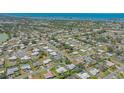 Stunning aerial view of community with waterways, with the property of interest circled at 301 Angelico Dr, Nokomis, FL 34275