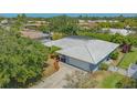 Aerial view of the property with its screen enclosed patio at 301 Angelico Dr, Nokomis, FL 34275