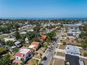 Expansive aerial view of a residential neighborhood with bay views in the distance, highlighting the home's location at 344 N Lantana N Ave, Sarasota, FL 34243