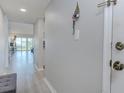 Clean and inviting entryway with modern gray walls and views of living space, providing a warm welcome at 446 Cerromar Rd # 291, Venice, FL 34293
